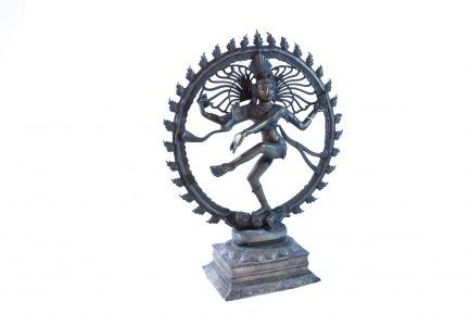 Person meditating in circle statue