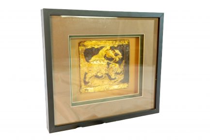 Tibetan Gilt-Copper Repoussé Plaque of a Snow Lion